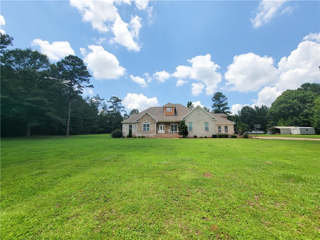 1810 Southlake Dr, Opelika, AL 36804, A spacious front yard unfolds before a stately sto
