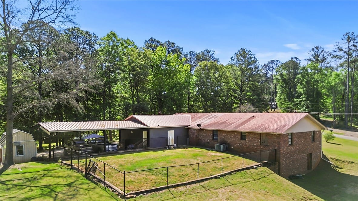1024 TRAIL, Valley, AL, 36854, This property features a fenced yard, shed, and ca