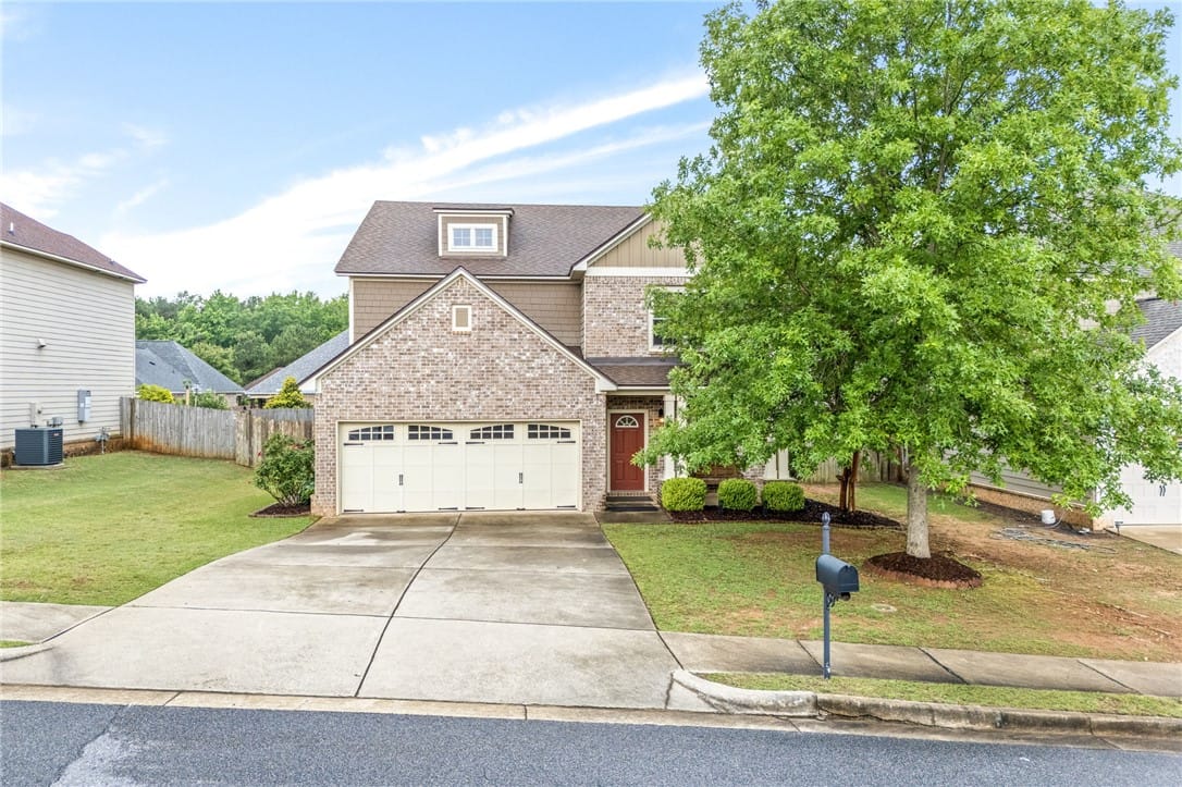 2431 Antler Ridge Dr, Auburn, AL 36832, A classic brick and siding two-story home with an