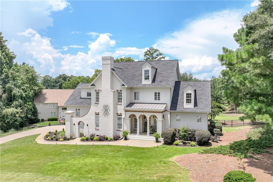 3308 Stonybrook Pl, Opelika, AL 36804, A stately manor with a grand arched entry and meti