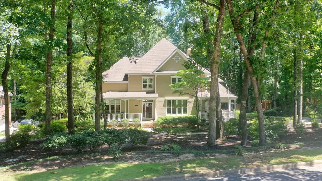 604 Camelot Way, Opelika, AL 36801, Nestled amidst mature trees, this residence offers