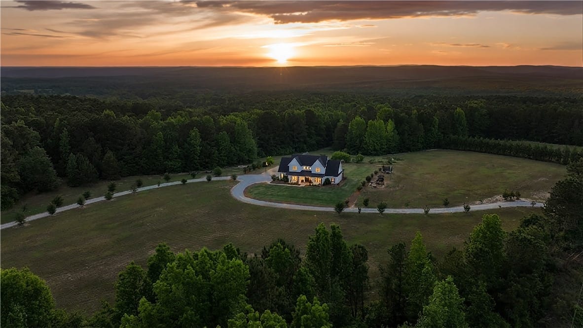 3154 Co Rd 54, Notasulga, AL 36866, Perched on a sprawling, tree-lined property, this