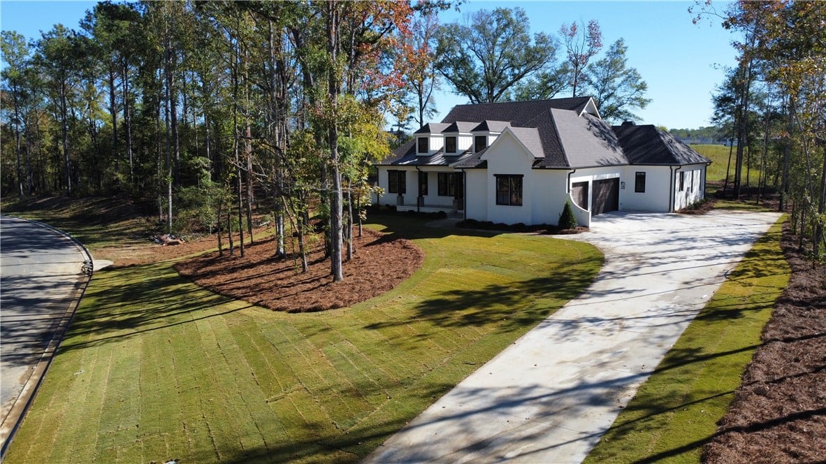 3213 Habersham Dr, Auburn, AL 36830, Mature trees frame a sprawling lawn and concrete d