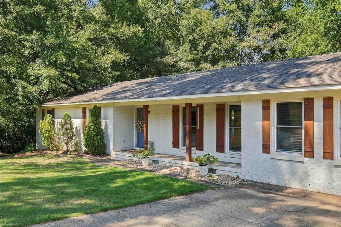 239 Denson Dr, Auburn, AL 36830, Shaded trees frame this brick ranch home featuring
