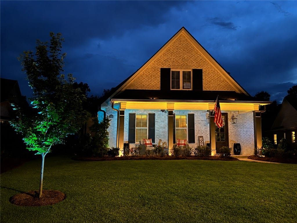 557 Arbor Dr, Auburn, AL 36830, Well-illuminated facade and inviting front porch c