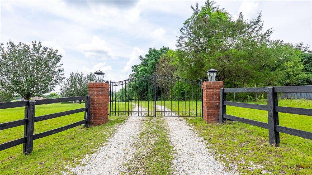 100 LEE ROAD 201, Salem, AL, 36874, A grand, gated entrance awaits, flanked by brick p