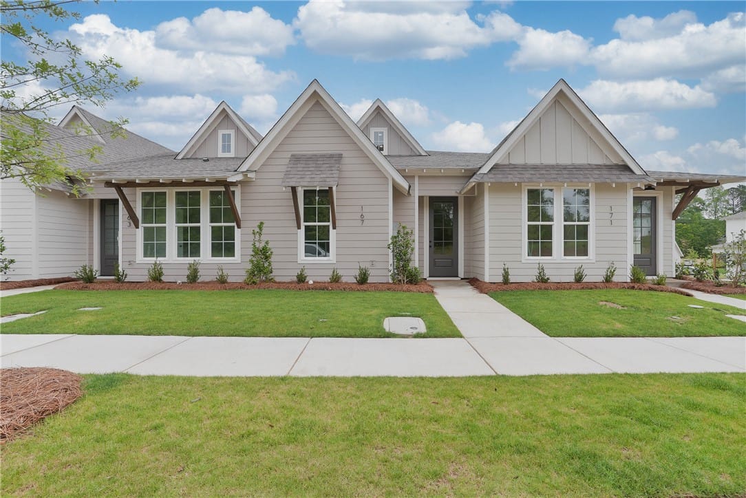Opelika, AL, A well-kept green lawn and tidy landscaping create