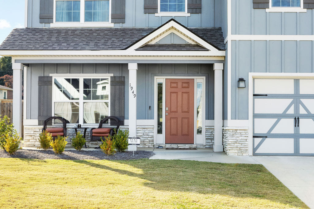 1949 Mallory Ln, Opelika, AL 36804, A welcoming facade with a covered porch, stone acc