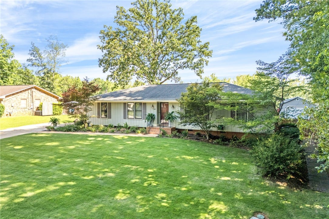 809 N Hills Dr, Opelika, AL 36801, A well-maintained lawn welcomes you to this classi
