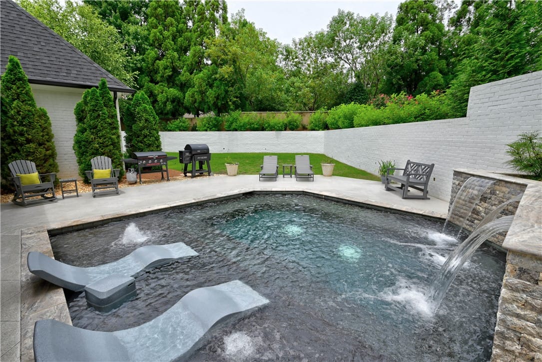 2615 Wilmington Ct #130, Auburn, AL 36830, An inviting in-ground pool with elegant waterfall