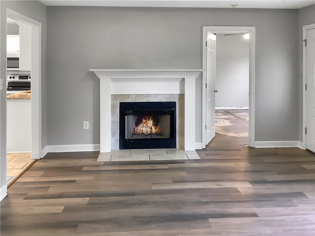 369 Lee Rd 242, Smiths Station, AL 36877, A comforting fireplace hearth centers this adaptab