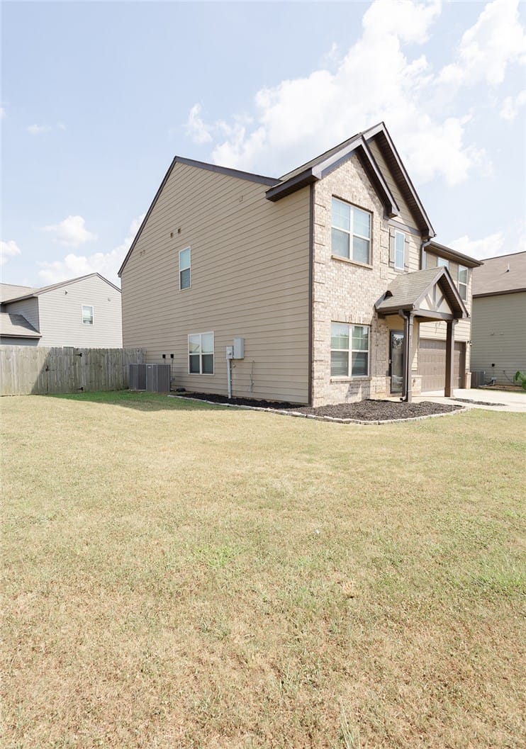 2715 Dunstan Ln, Opelika, AL 36804, A well-maintained lawn frames this classic residen