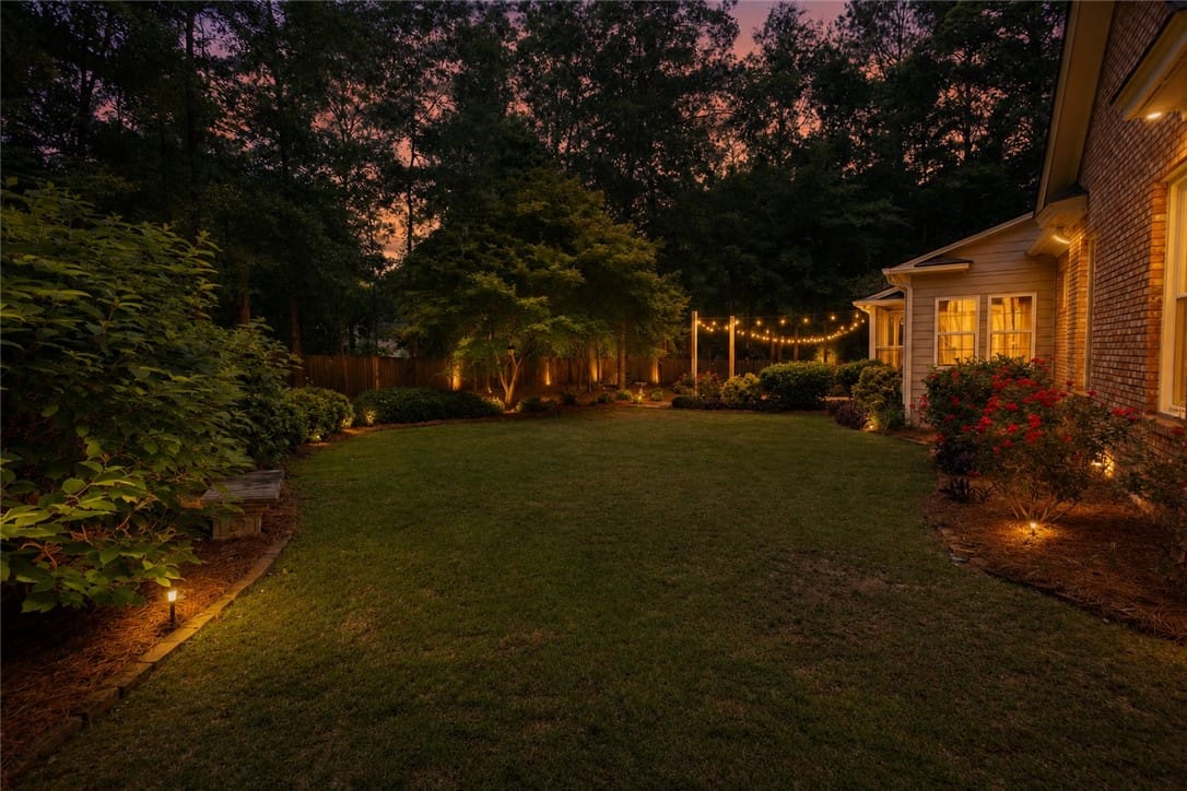 162 Asheton Ln, Auburn, AL 36830, A well-maintained lawn and illuminated landscaping