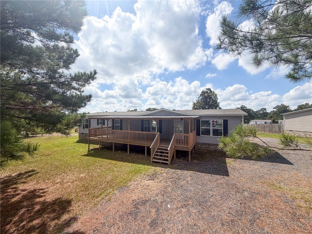 140 Lee Rd #2166, Salem, AL 36874, A spacious wooden front porch welcomes guests to t