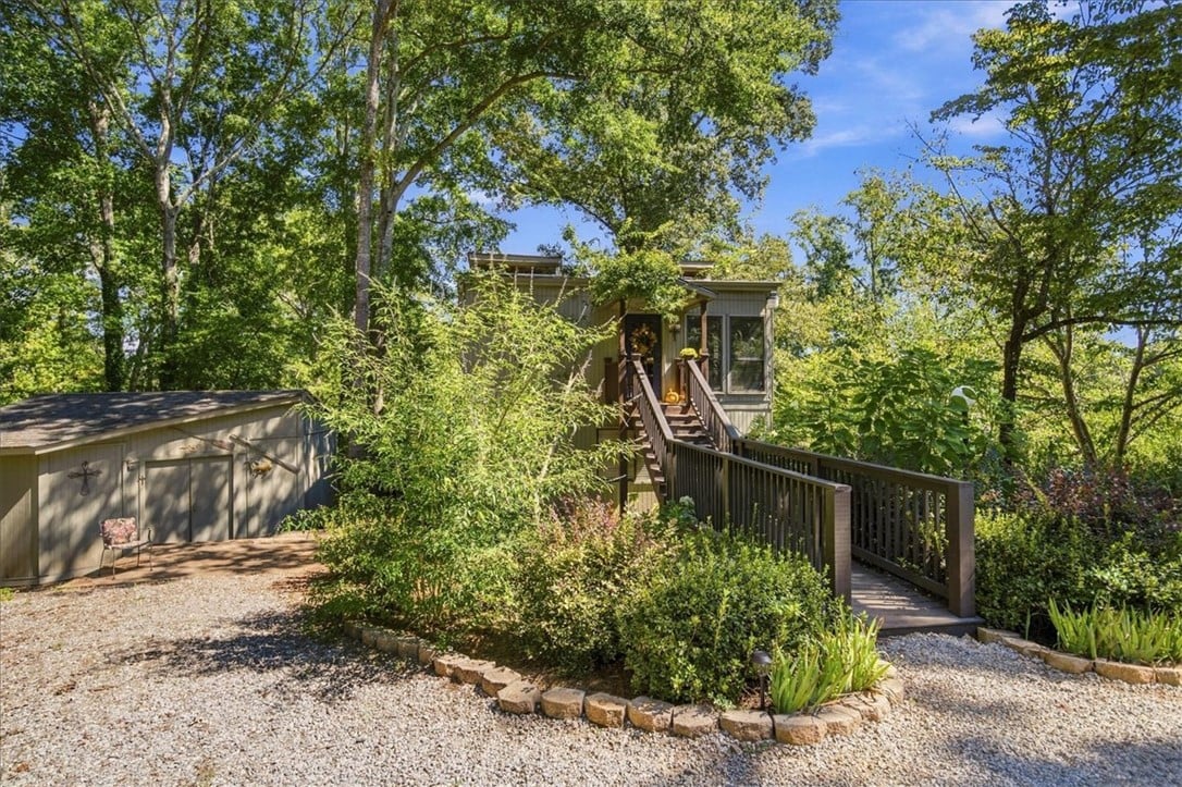 140 Natchez Rd, Dadeville, AL 36853, A wooden ramp leads to the elevated entryway of th