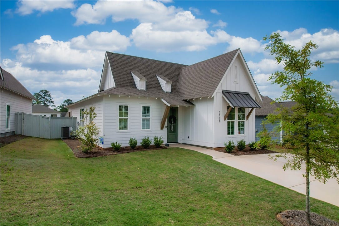 3128 BOTTLE, Auburn, AL, 36830, A classic white home with striking dark roof and c