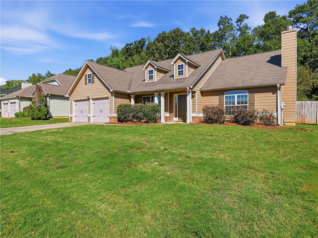 308 Gwynne's Way, Opelika, AL 36804, Manicured green lawn sweeps up to this classic sid