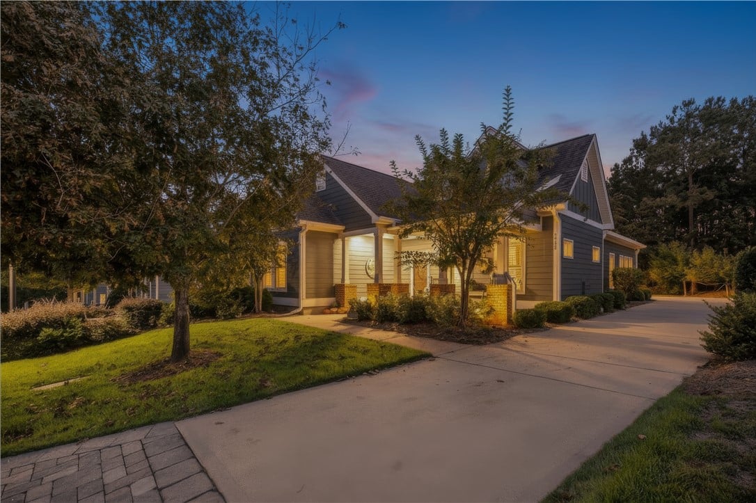 3313 Double Eagle Ln, Opelika, AL 36801, Mature landscape frames the entire property offeri