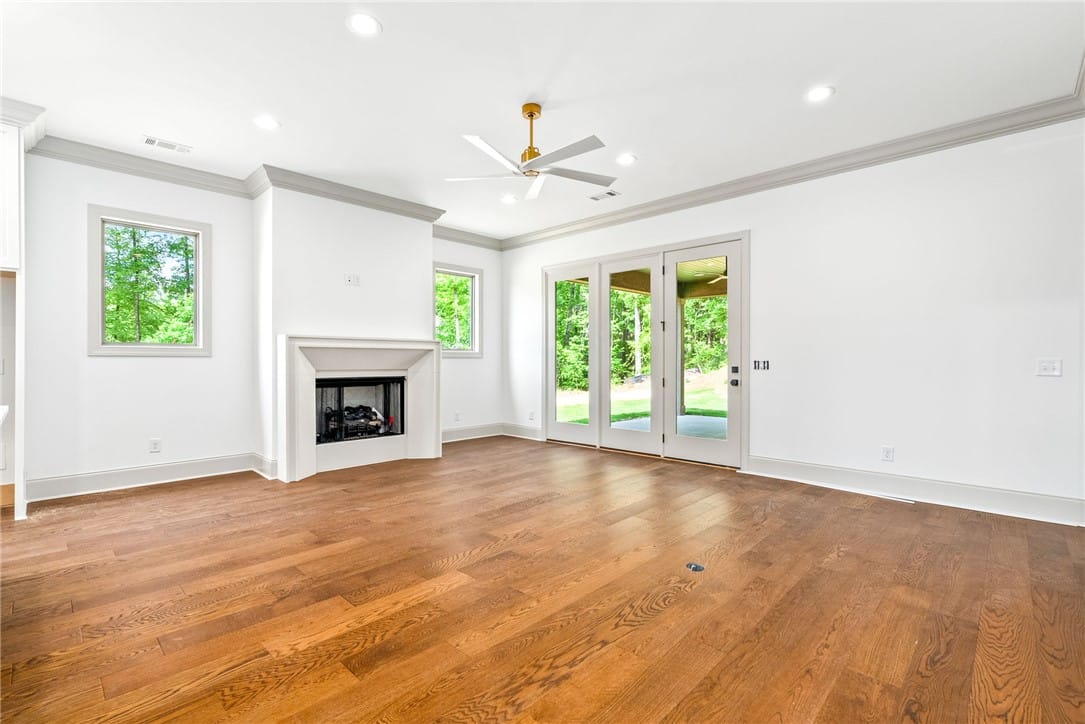 588 Glenview Ct, Auburn, AL 36830, With windows flanking the fireplace and a wall of