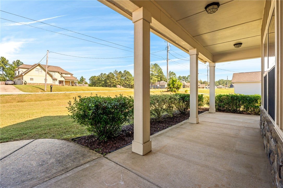 521 Lee Rd 2206, Salem, AL 36874, A spacious covered concrete porch overlooks the gr
