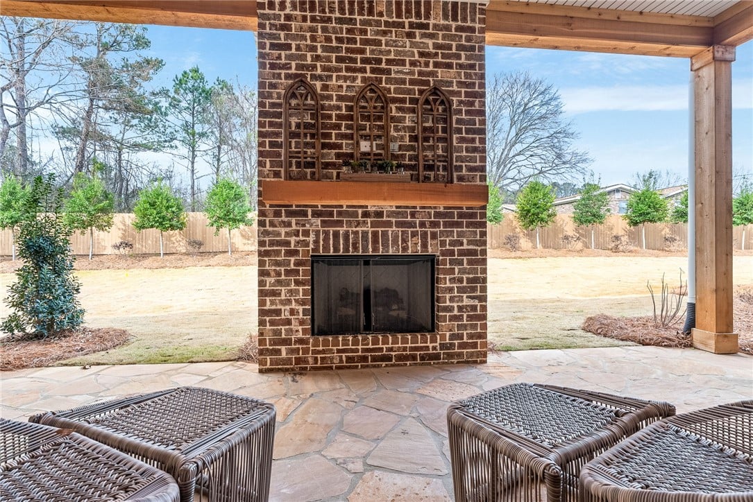 2245 BELLEVUE, Auburn, AL, 36830, A robust brick fireplace anchors the covered stone