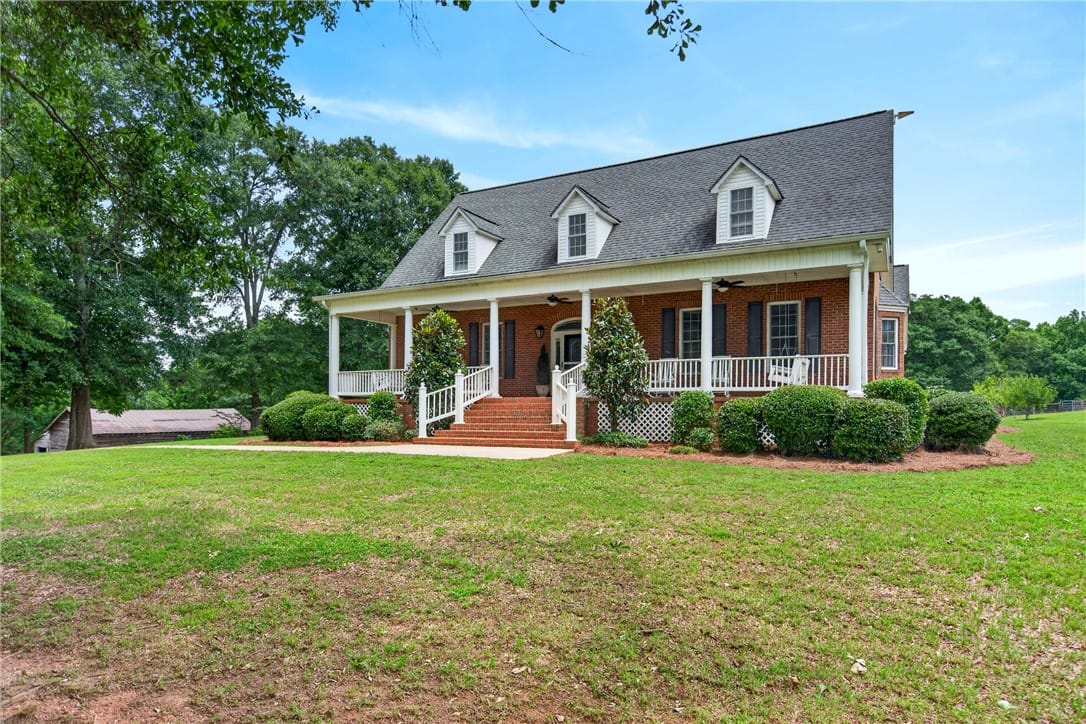 2302 Co Rd 297, Five Points, AL 36855, Brick facade with welcoming front porch and mature