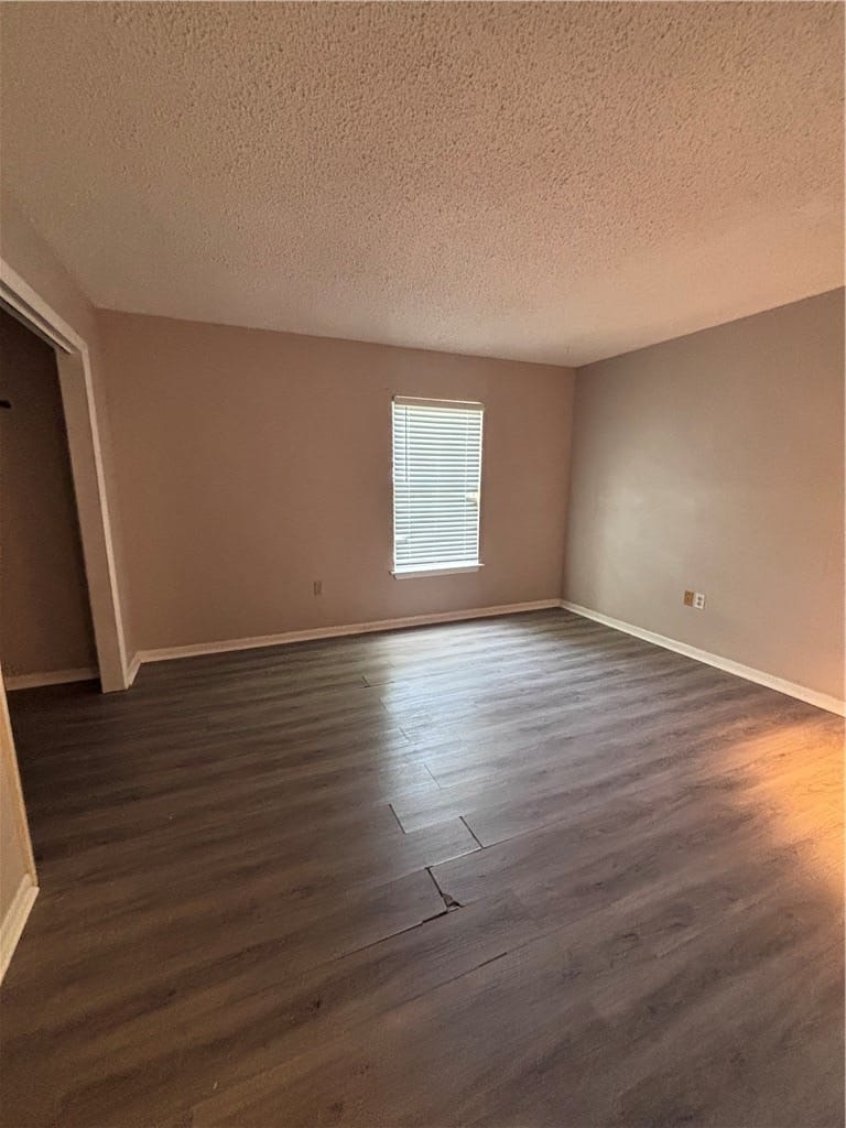 144 E University Dr k106, Auburn, AL 36832, Well-lit room features durable wood flooring and a
