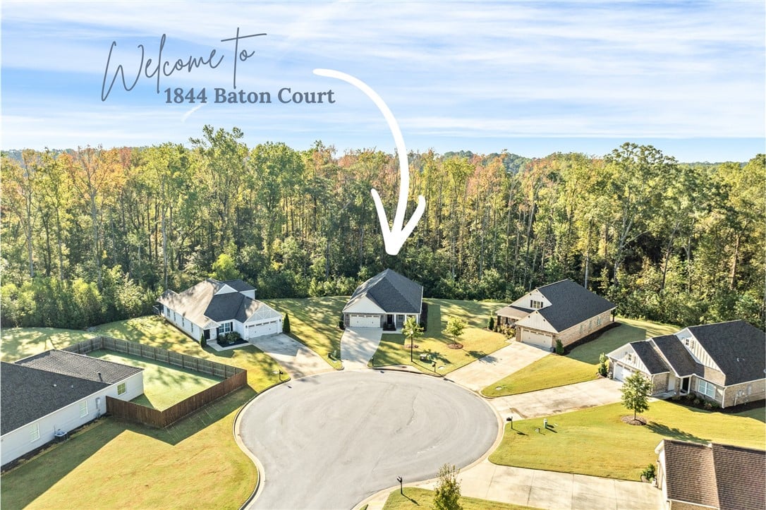 1844 Baton Ct, Opelika, AL 36801, An aerial perspective showcases a sweet suburban c