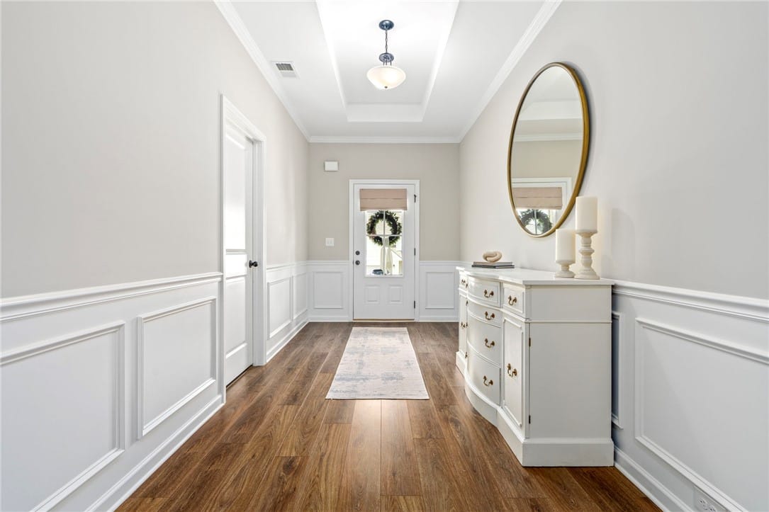 2106 Forrest Cv Dr, Auburn, AL 36879, A graceful entry with warm wood flooring and class