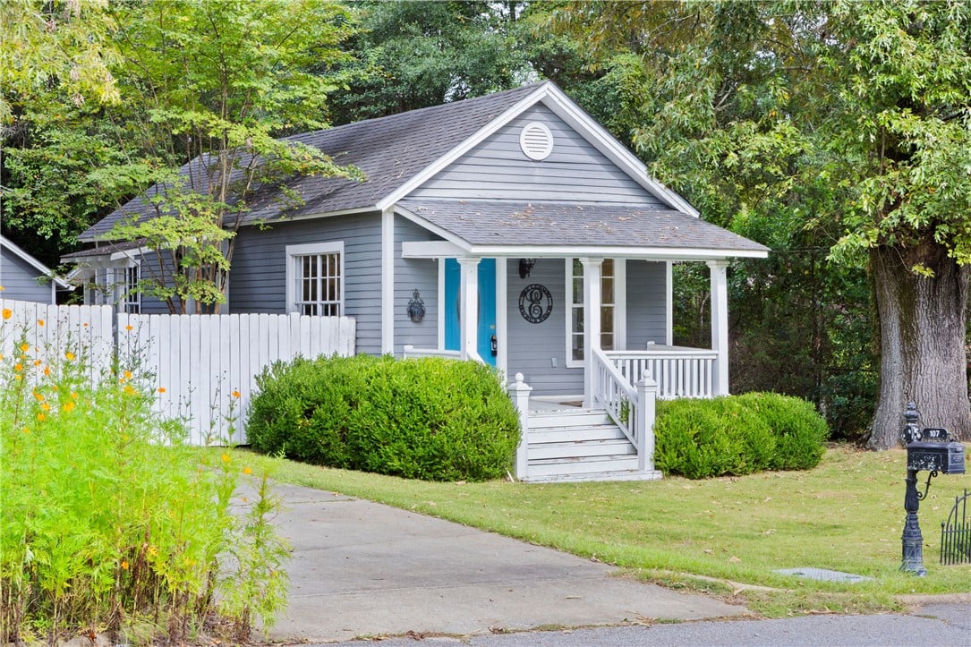 107 17th St, Opelika, AL 36801, Mature trees frame a charming front porch overlook