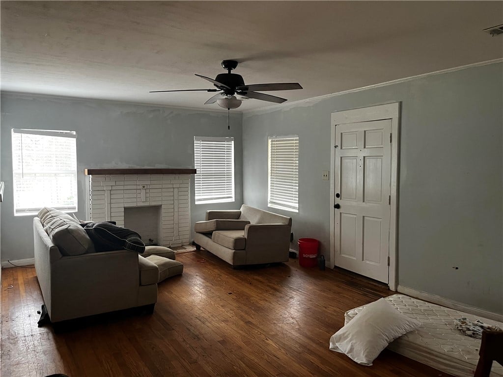 686 Co Rd 61, Roanoke, AL 36274, A classic brick fireplace centers this inviting li