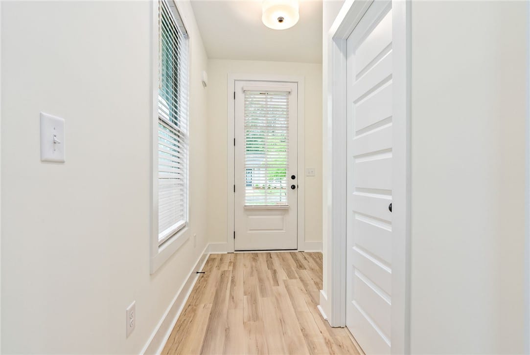 151 SUMMER, Opelika, AL, 36801, Blonde wood-look flooring extends through this wel