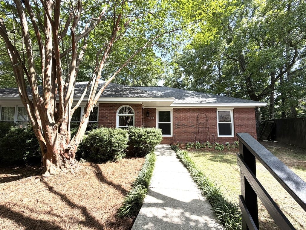 1398 Kurt Cir, Auburn, AL 36830, A classic brick exterior welcomes with mature tree