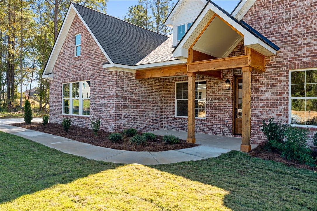 2339 Dalby Pl, Opelika, AL 36804, Rich brickwork pairs with natural wood columns def