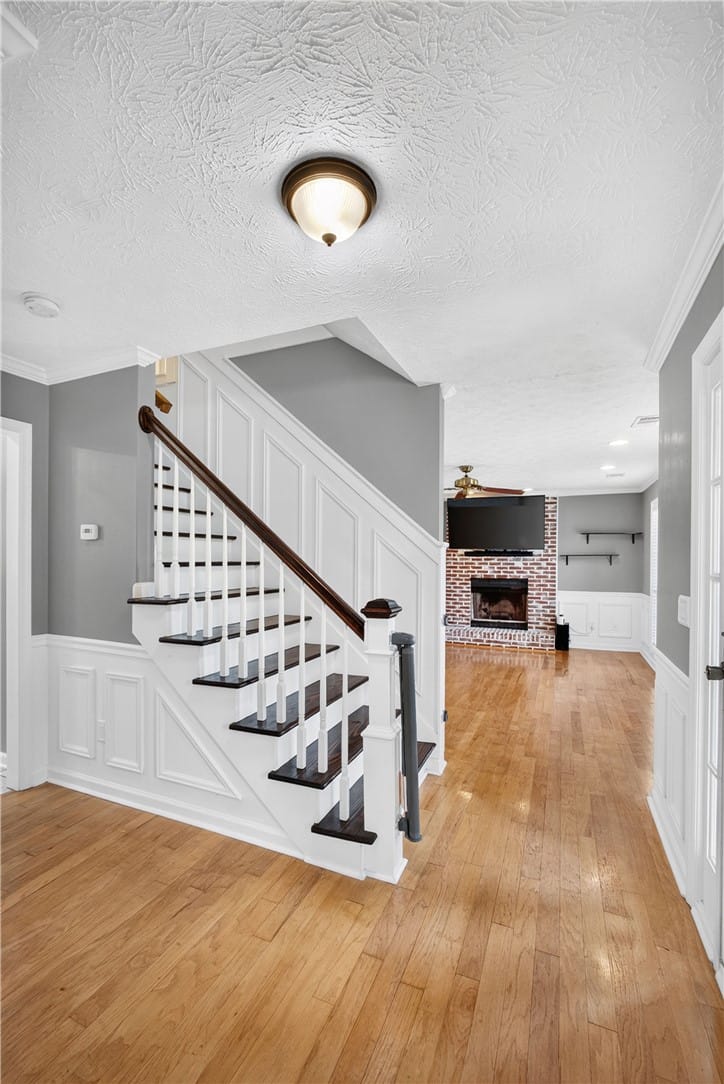 1030 Birch Cir, Auburn, AL 36830, A striking staircase with dark wood treads and whi