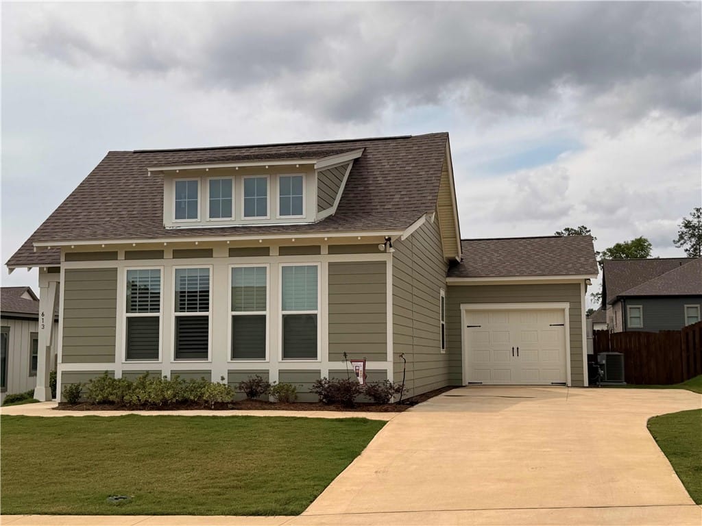 613 Shropshire Dr, Auburn, AL 36832, Concrete driveway with added parking pad offers co