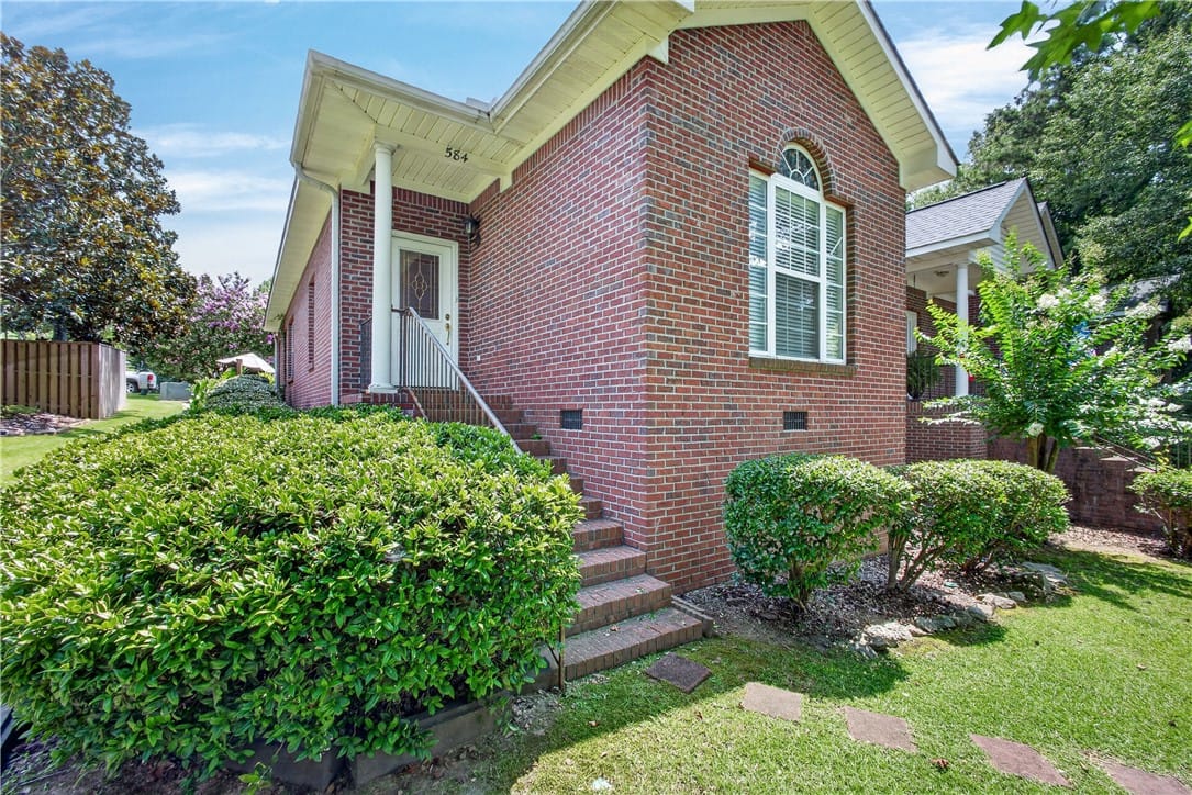 584 E Thach Ave, Auburn, AL 36830, A classic brick exterior with a welcoming porch an