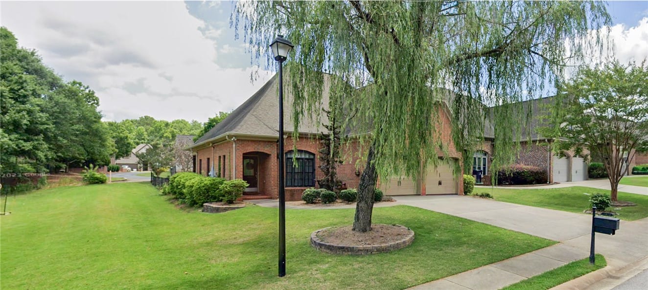 2172 N Donahue Dr, Auburn, AL 36879, Stately brick home beautifully accentuated by lush