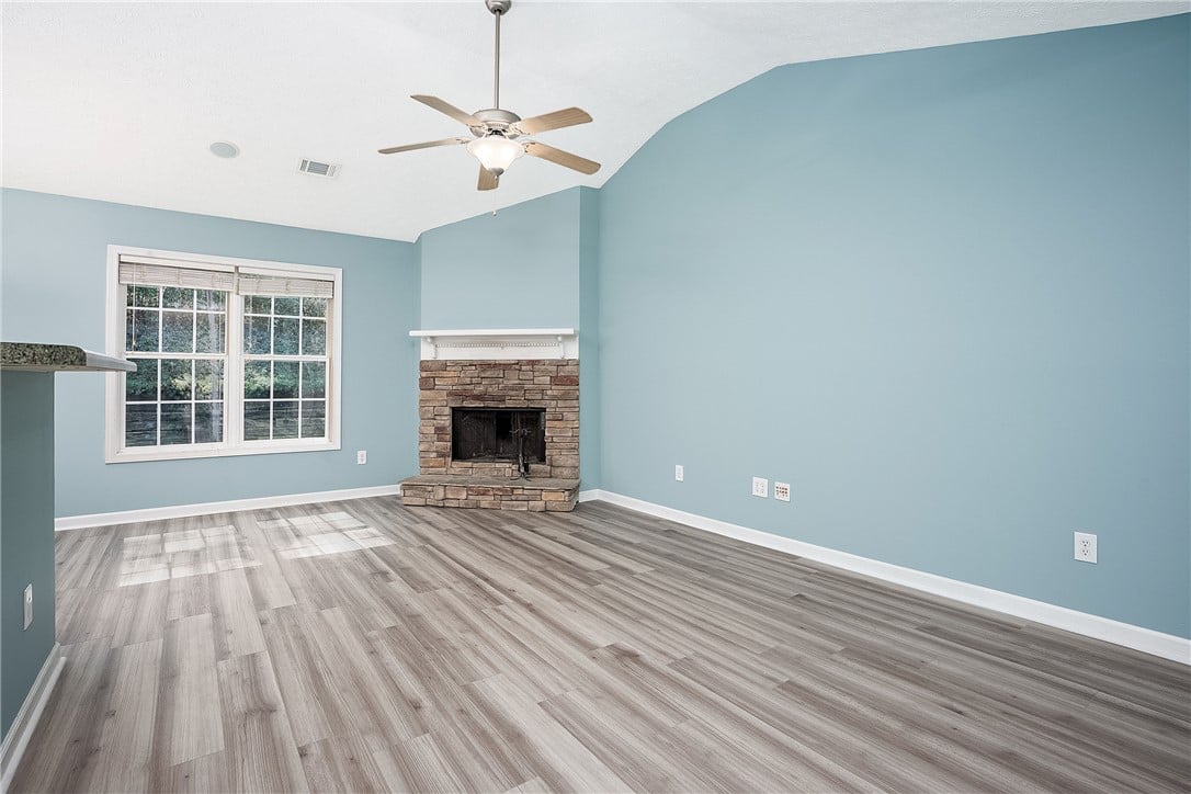 4298 Live Oak Dr, Auburn, AL 36830, An inviting stone hearth anchors this light-filled
