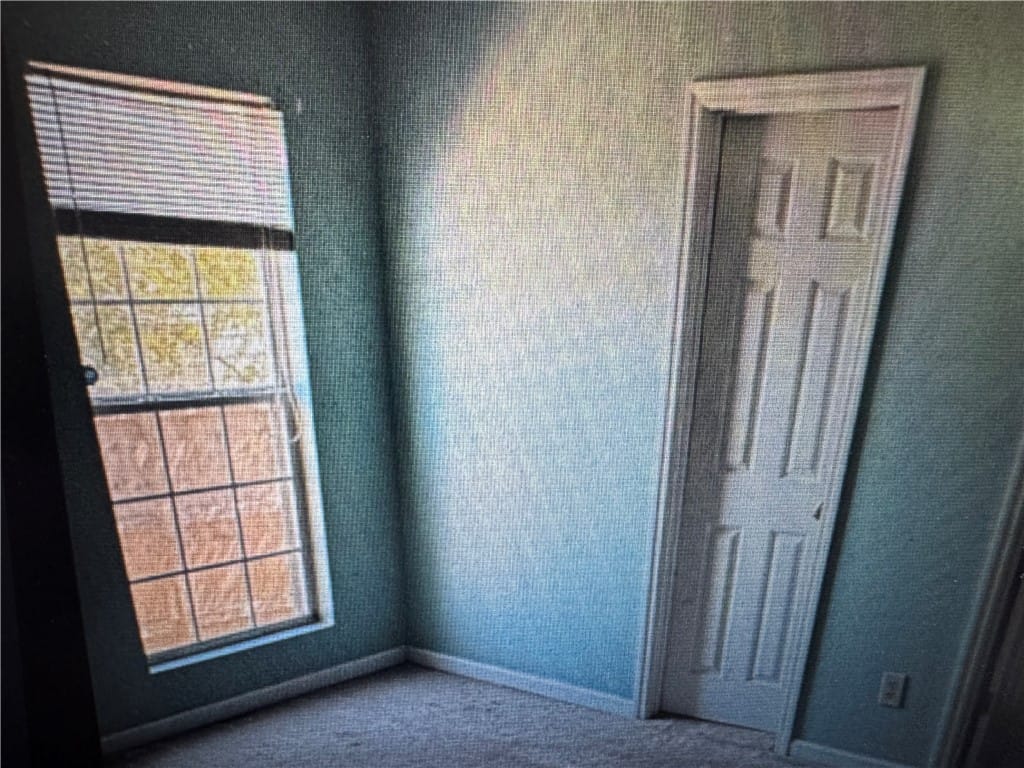529 Mimosa Rd, Phenix City, AL 36870, This cozy bedroom features soft carpet and a windo