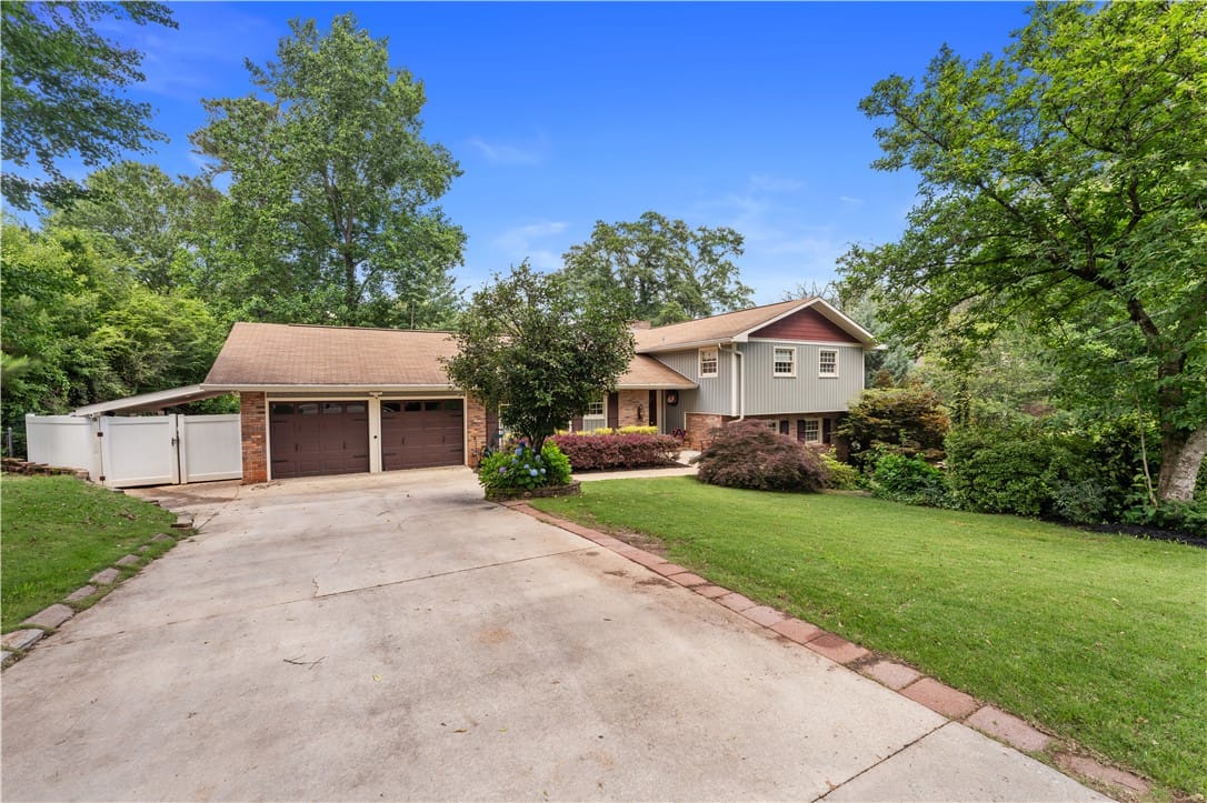 212 Redwood Ct, Auburn, AL 36830, A well-maintained home featuring a two-car garage,