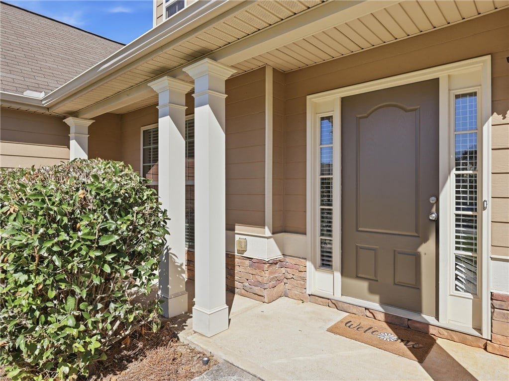 308 Gwynne's Way, Opelika, AL 36804, White columns and stone accents frame the welcomin