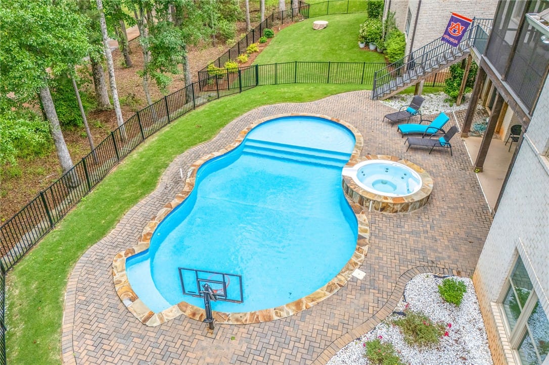 1179 Still Hunt Ln, Auburn, AL 36832, An inviting backyard oasis offers a free-form pool
