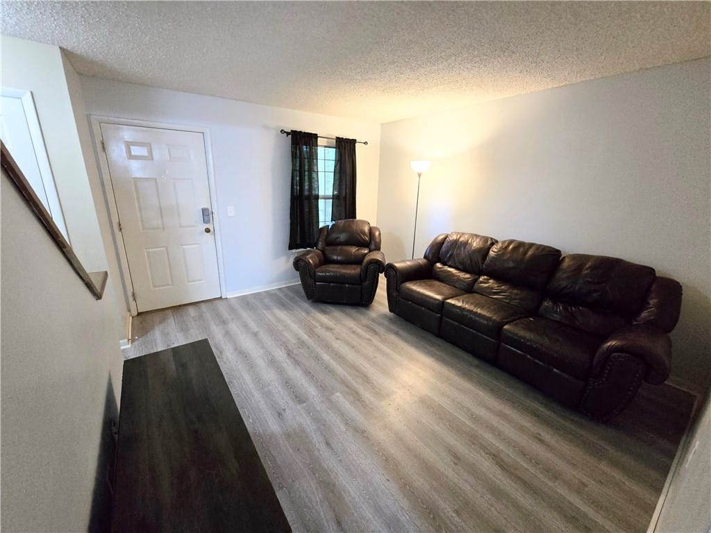 168 E University Dr l204, Auburn, AL 36832, Clean-lined living space with durable flooring off