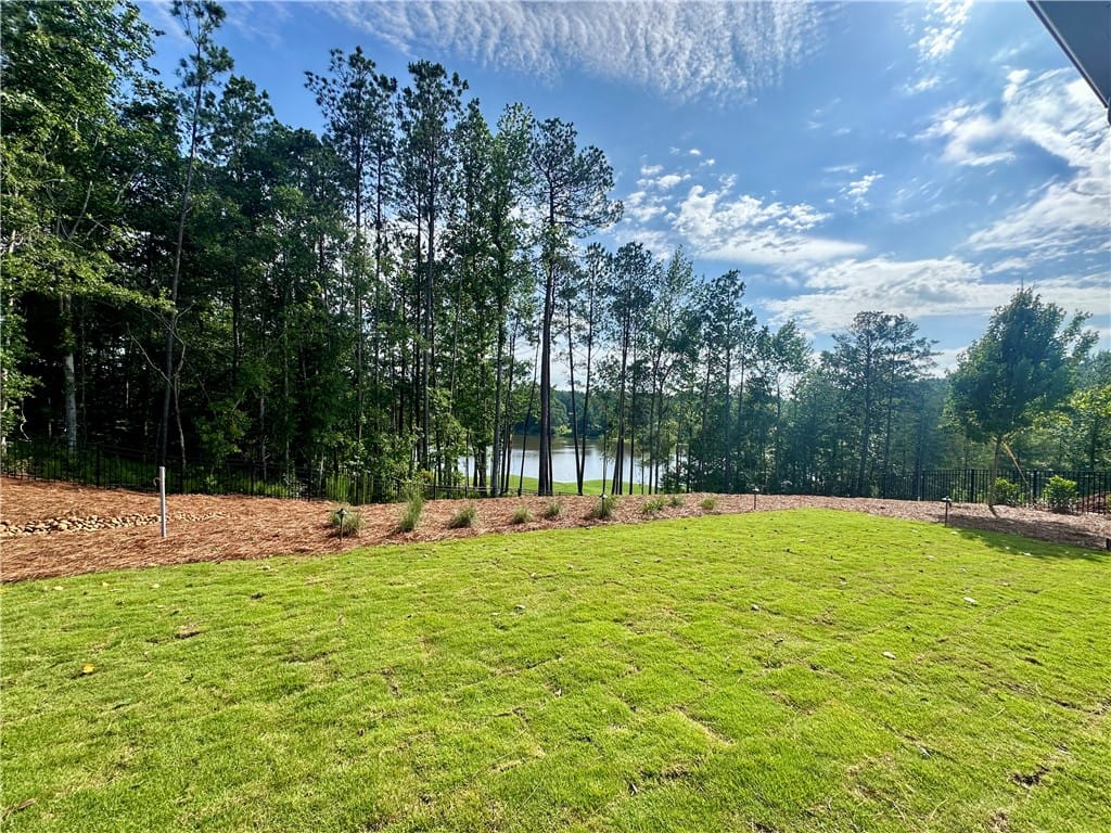 1320 Oakmont, Auburn, AL, 36830, Green lawn slopes towards a serene lake, bordered