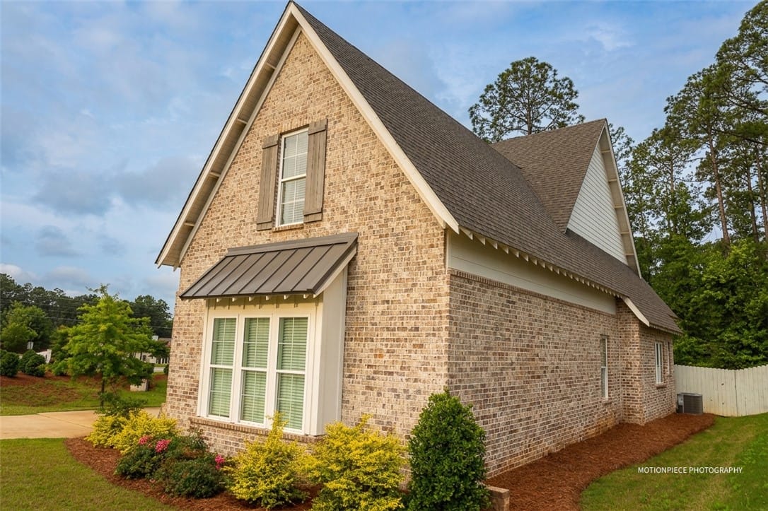 1203 Ruth Wy, Auburn, AL 36830, A classic brick exterior showcases a bay window wi