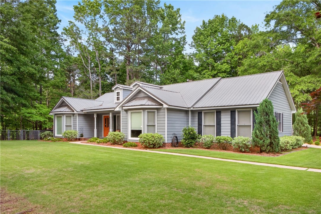 655 Lee Road 735 #737, Opelika, AL 36804, Lush landscaping and a manicured lawn enhance this