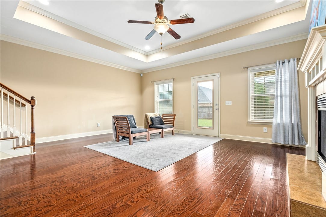 2431 Antler Ridge Dr, Auburn, AL 36832, Refined wood floors and a tray ceiling frame this