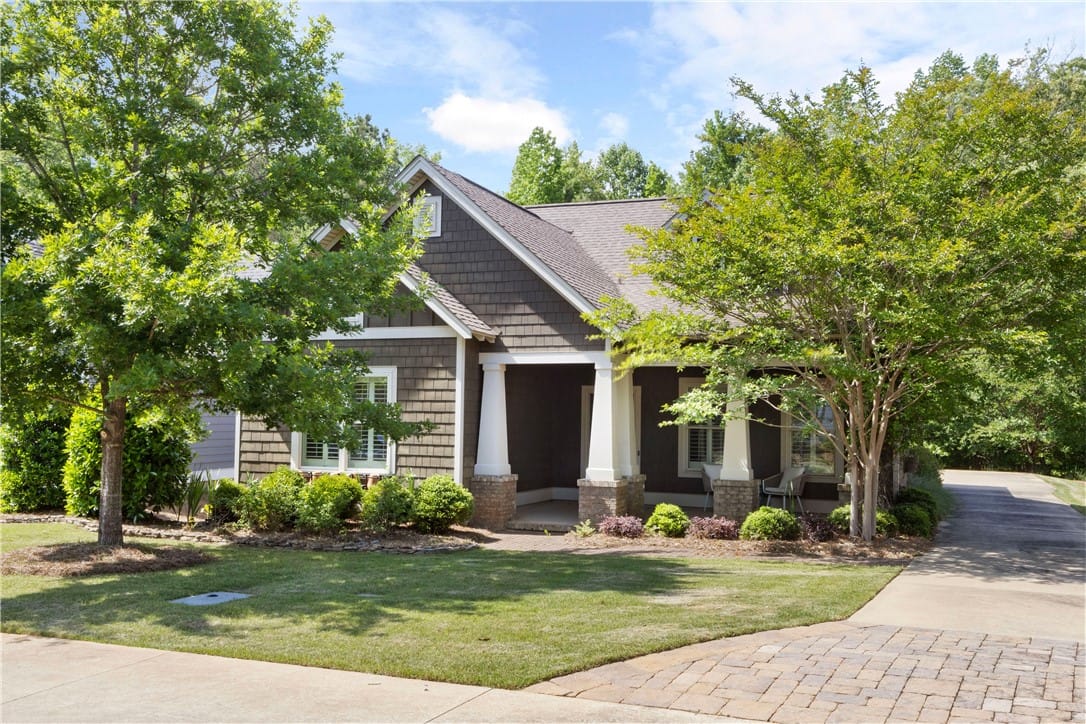 3610 Double Eagle Ln, Opelika, AL 36801, An inviting front elevation with a covered porch a