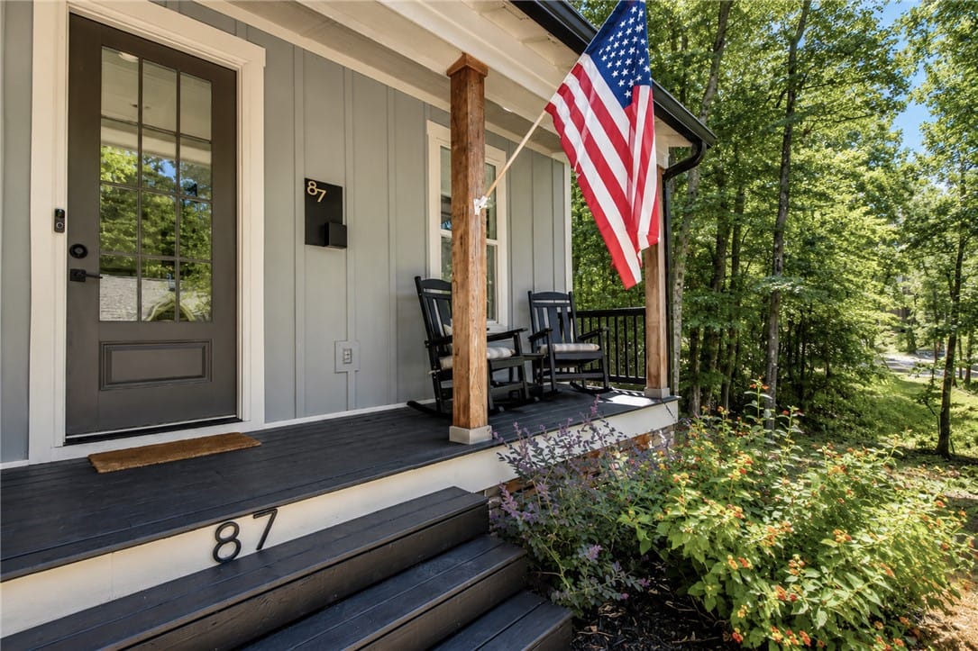 87 River Birch Trl, Dadeville, AL 36853, A welcoming front porch beckons with rocking chair